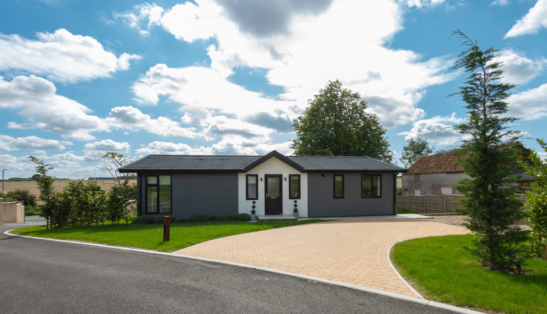 lusso park home the majestic prestige with a driveway and large garden